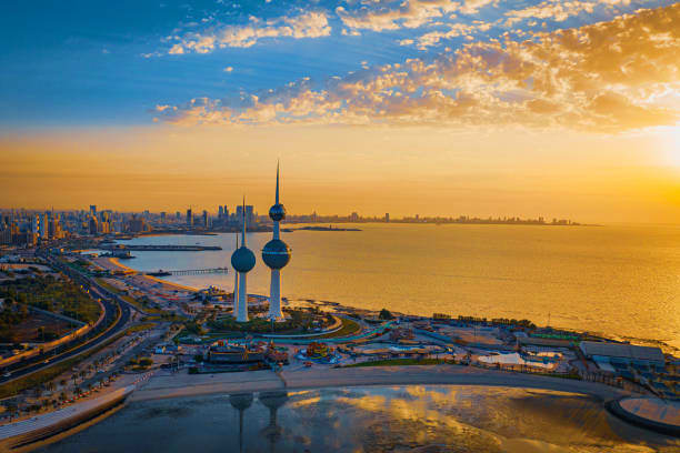 Kuwait Visa Kuwait Towers with cityscape and Arabian Gulf at sunset, iconic landmarks of Kuwait City skyline